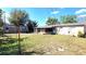 Expansive backyard with a large open yard and utility shed, perfect for outdoor activities and storage at 1118 Arrowsmith Ave, Orlando, FL 32809