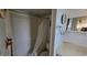 Bathroom featuring shower with curtain, toilet, sink and mirror at 1118 Arrowsmith Ave, Orlando, FL 32809