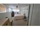Bright bedroom featuring neutral walls, ceiling fan, and a comfortable bed at 1118 Arrowsmith Ave, Orlando, FL 32809