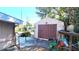 Exterior view of a detached garage structure, offering ample space for storage and projects at 1118 Arrowsmith Ave, Orlando, FL 32809