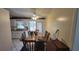 Bright eat-in kitchen with wooden table and a view to the sunroom at 1118 Arrowsmith Ave, Orlando, FL 32809