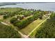Large estate with well-defined property lines, mature trees, and a sprawling green lawn at 11200 Lane Park Rd, Tavares, FL 32778