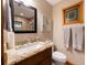 Charming bathroom with granite counters, decorative stained glass window, and updated fixtures at 11200 Lane Park Rd, Tavares, FL 32778