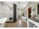 Luxurious primary bath with a soaking tub, walk-in shower, and vanity at 11200 Lane Park Rd, Tavares, FL 32778