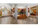 Open concept area with piano room and tiled floors at 11200 Lane Park Rd, Tavares, FL 32778