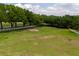 Expansive land with a white fence and mature trees offers privacy and scenic views at 11200 Lane Park Rd, Tavares, FL 32778