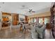 Comfortable living room with a fireplace, built-in shelves, and tile flooring at 11200 Lane Park Rd, Tavares, FL 32778
