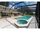This is a screened pool area with an attached spa and brick steps that lead to the house at 11200 Lane Park Rd, Tavares, FL 32778