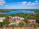 Beautiful aerial view of the lakeside community with pool, tennis courts, and lush landscaping at 1162 Carmel Cir # 440, Casselberry, FL 32707