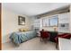 Cozy bedroom featuring a twin bed, a desk, and built-in shelving, perfect for a study or guest room at 1162 Carmel Cir # 440, Casselberry, FL 32707