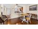 Cozy dining area with beautiful wood floors adjacent to kitchen and living space at 1162 Carmel Cir # 440, Casselberry, FL 32707