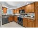 Efficient kitchen featuring light oak cabinetry, modern appliances, and countertops at 1162 Carmel Cir # 440, Casselberry, FL 32707