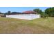 Large backyard with a well-maintained white fence, offering privacy and security for outdoor activities at 12614 Hawkstone Dr, Windermere, FL 34786
