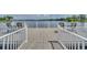Community dock featuring chairs, tables and scenic lake views for relaxation and enjoyment at 12614 Hawkstone Dr, Windermere, FL 34786