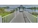 Enjoy this community dock with a covered gazebo and scenic lake views at 12614 Hawkstone Dr, Windermere, FL 34786