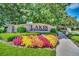 Community entrance sign for Lakes of Windermere, surrounded by colorful landscaping and lush greenery at 12614 Hawkstone Dr, Windermere, FL 34786
