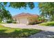 Charming home showcasing a well-manicured lawn and a two-car garage, adding to its curb appeal at 12614 Hawkstone Dr, Windermere, FL 34786