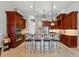 Open concept kitchen with breakfast bar, stainless steel appliances, and custom cabinetry at 12614 Hawkstone Dr, Windermere, FL 34786