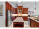 Well-equipped kitchen with stainless steel appliances, custom cabinets, and a center island at 12614 Hawkstone Dr, Windermere, FL 34786