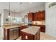 Spacious kitchen with stainless steel appliances, custom cabinets, granite countertops, and tile flooring at 12614 Hawkstone Dr, Windermere, FL 34786