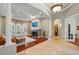 Open-concept living room with fireplace, tile and wood flooring, and abundant natural light at 12614 Hawkstone Dr, Windermere, FL 34786