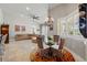 Bright living room with large windows, comfortable seating, and elegant chandelier at 12614 Hawkstone Dr, Windermere, FL 34786