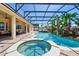 Sparkling pool and spa within a screened enclosure, complemented by a spacious patio area at 12614 Hawkstone Dr, Windermere, FL 34786