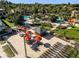Aerial view of an outdoor lounge and bar area, surrounded by palm trees and community amenities at 130 Palermo St, Davenport, FL 33897