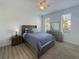 Bright bedroom with natural light, a ceiling fan, and neutral-toned furnishings at 130 Palermo St, Davenport, FL 33897