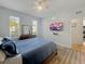 Cozy bedroom featuring a queen-sized bed and TV at 130 Palermo St, Davenport, FL 33897