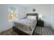 Comfortable bedroom with laminate floors and a large window at 130 Palermo St, Davenport, FL 33897