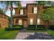 Charming townhome with brick-paved drive, lush landscaping, and inviting curb appeal at 130 Palermo St, Davenport, FL 33897