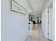 Inviting hallway with tile flooring leading to an open-concept living space at 130 Palermo St, Davenport, FL 33897