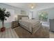 Spacious main bedroom with a king-sized bed, private balcony, and plenty of natural light at 130 Palermo St, Davenport, FL 33897