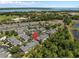 Aerial view of a townhome community with well-maintained landscaping and convenient access to nearby lake and other amenities at 131 Heritage Park St, Winter Springs, FL 32708