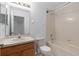 Bathroom featuring vanity, toilet, and a bathtub with shower and white tiled wall surround at 131 Heritage Park St, Winter Springs, FL 32708