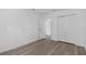 A bedroom is enhanced by wood-look floors, a large closet, and white trim at 131 Heritage Park St, Winter Springs, FL 32708