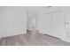 Spacious bedroom features wood-look floors and ample closet space with a neutral color palette at 131 Heritage Park St, Winter Springs, FL 32708