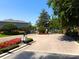 Secured community entrance featuring manicured landscaping and brick-paved driveway for a welcoming first impression at 131 Heritage Park St, Winter Springs, FL 32708