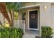 Inviting front porch with a cheerful wreath and a doormat that says 'Welcome Peeps' at 131 Heritage Park St, Winter Springs, FL 32708