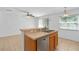 Kitchen view features stainless dishwasher, double sink, and open access to a dining area at 131 Heritage Park St, Winter Springs, FL 32708