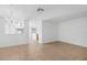 Open living room with tile flooring and plenty of natural light at 131 Heritage Park St, Winter Springs, FL 32708