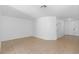 Large living room with tile flooring and two entry doors at 131 Heritage Park St, Winter Springs, FL 32708