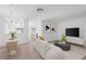 Living room and dining area with modern decor, and tile flooring at 131 Heritage Park St, Winter Springs, FL 32708