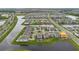 High angle aerial showcasing a community with homes surrounding lakes and verdant greenery at 13640 Haulover Beach Ln, Orlando, FL 32827