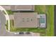Aerial view of a house with a screened-in pool and well-maintained landscaping at 13640 Haulover Beach Ln, Orlando, FL 32827