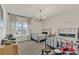 Spacious bedroom with two beds, large window, and playful decor at 13640 Haulover Beach Ln, Orlando, FL 32827