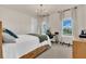 Cozy bedroom with large windows, modern lighting, and comfortable furnishings at 13640 Haulover Beach Ln, Orlando, FL 32827