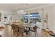 Dining area with a wooden table, chandelier, and view of the backyard through sliding glass doors at 13640 Haulover Beach Ln, Orlando, FL 32827