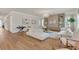 Spacious living room featuring wood floors, modern decor, recessed lighting, and a chandelier at 13640 Haulover Beach Ln, Orlando, FL 32827